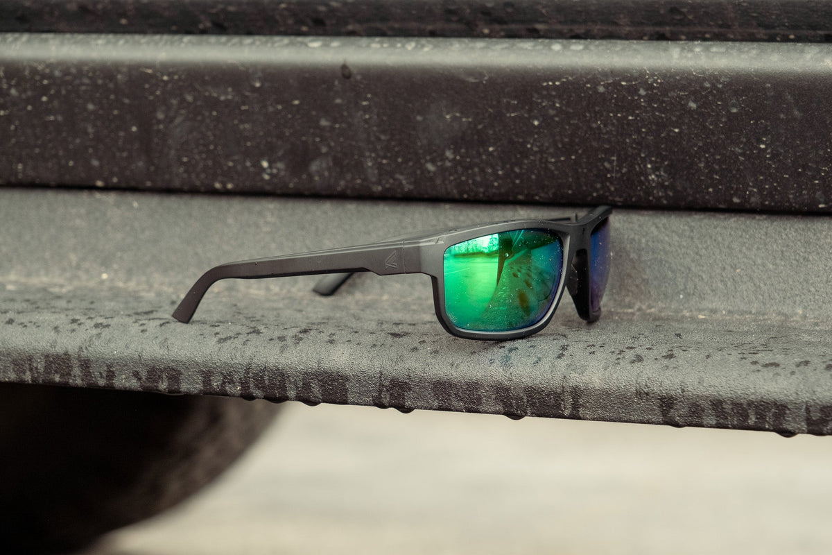 green mirror lens safety glasses on truck step