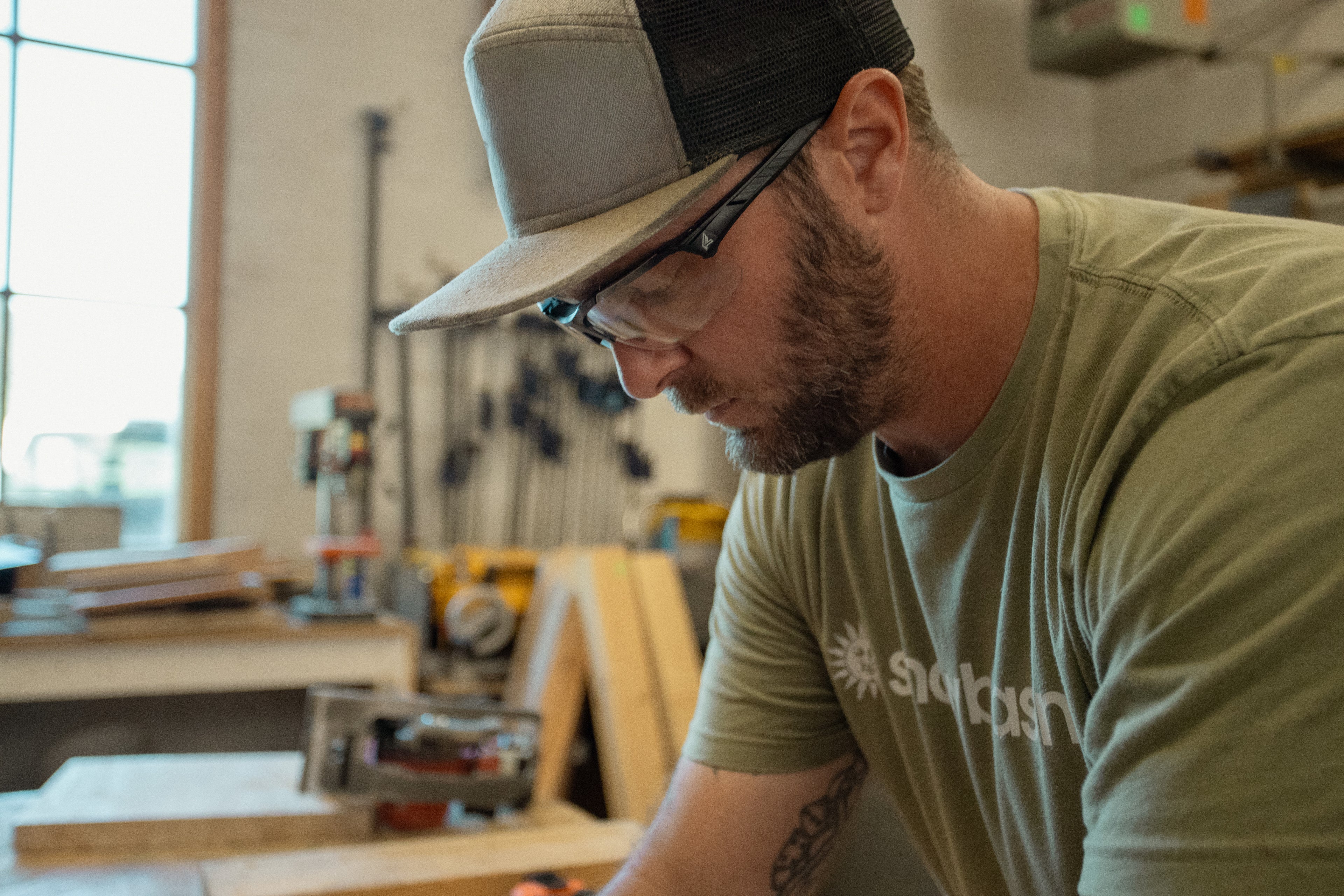 Edge Tacana Clear Safety Glasses Protecting Worker While Performing Woodworking Task