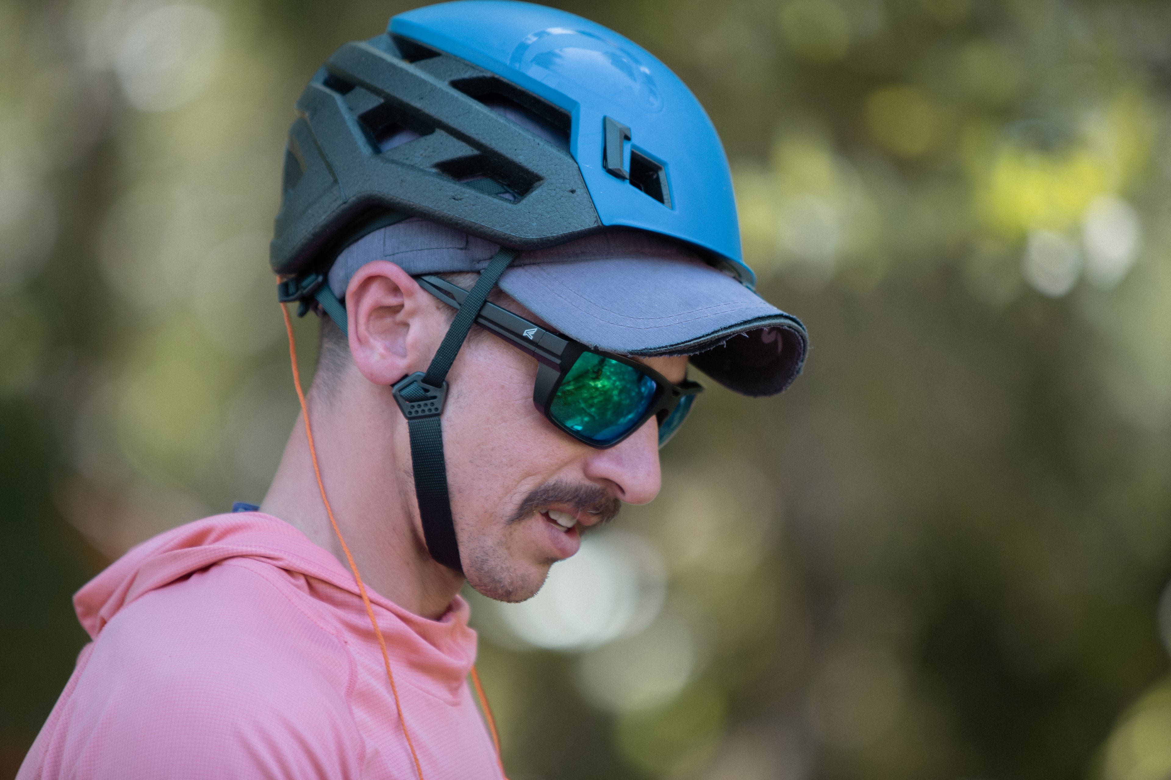 Tree Trimming Person Wearing Safety Glasses and a Blue and Black Helmet