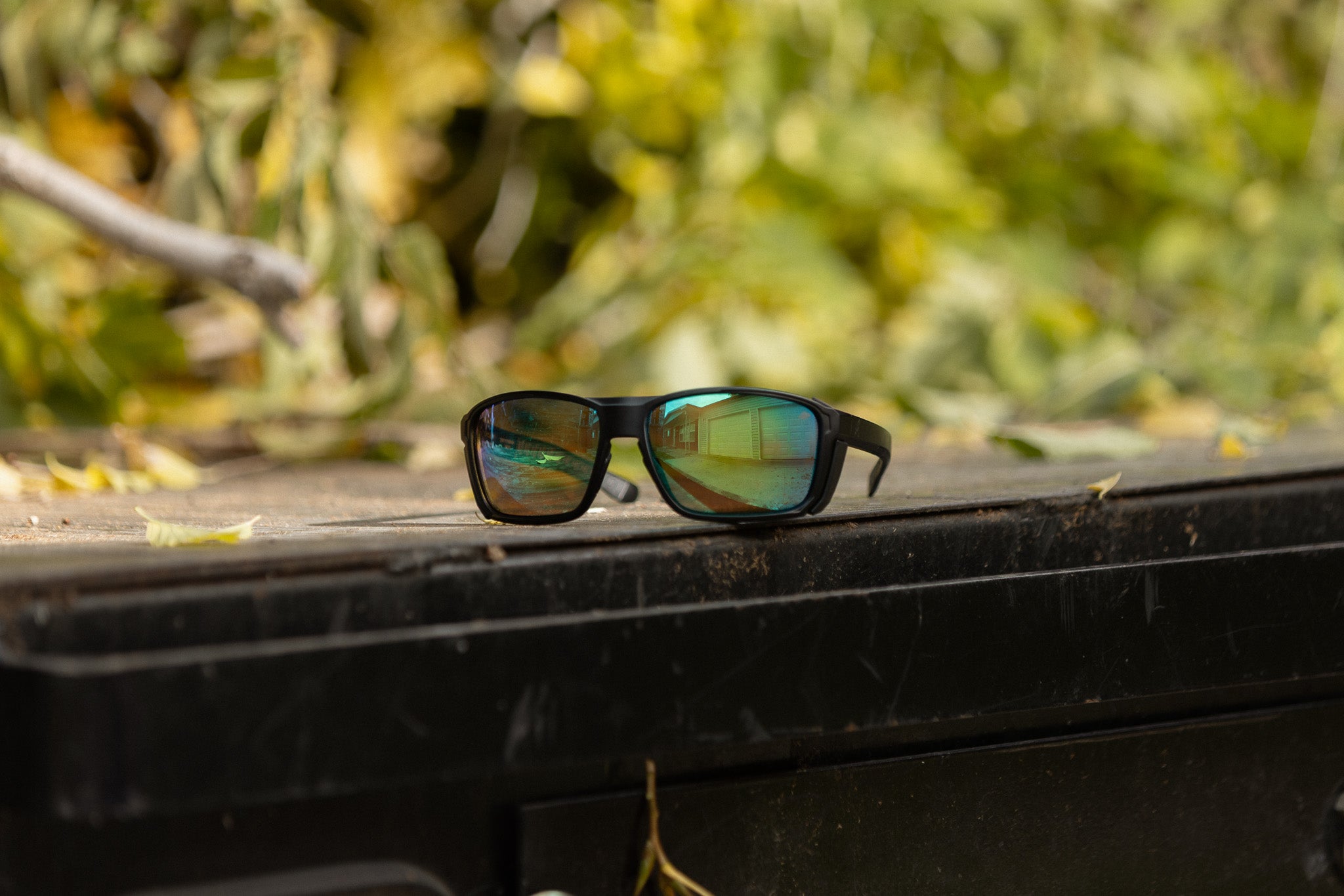 Safety glasses with green lenses on the back of a truck 