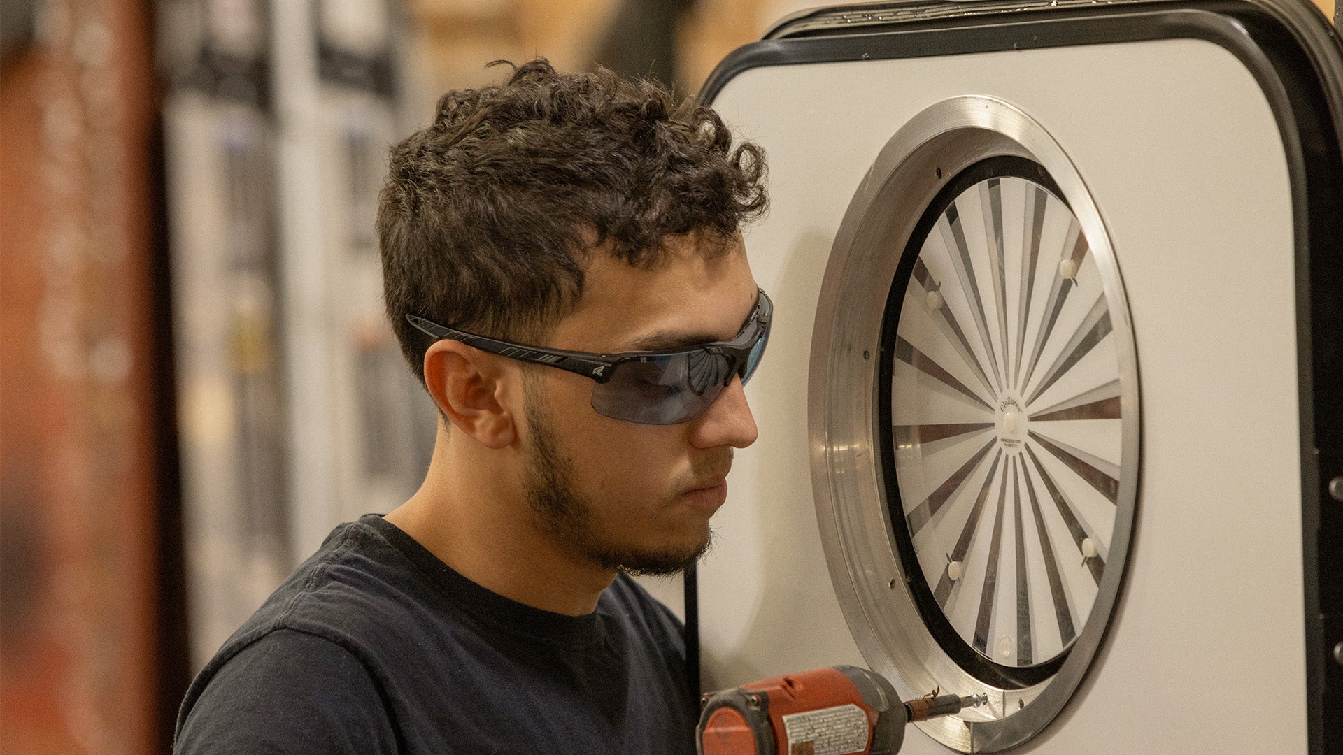 Edge Tacana Safety Glasses Protecting Worker Eyes While Performing Tasks in Manufacturing Facility
