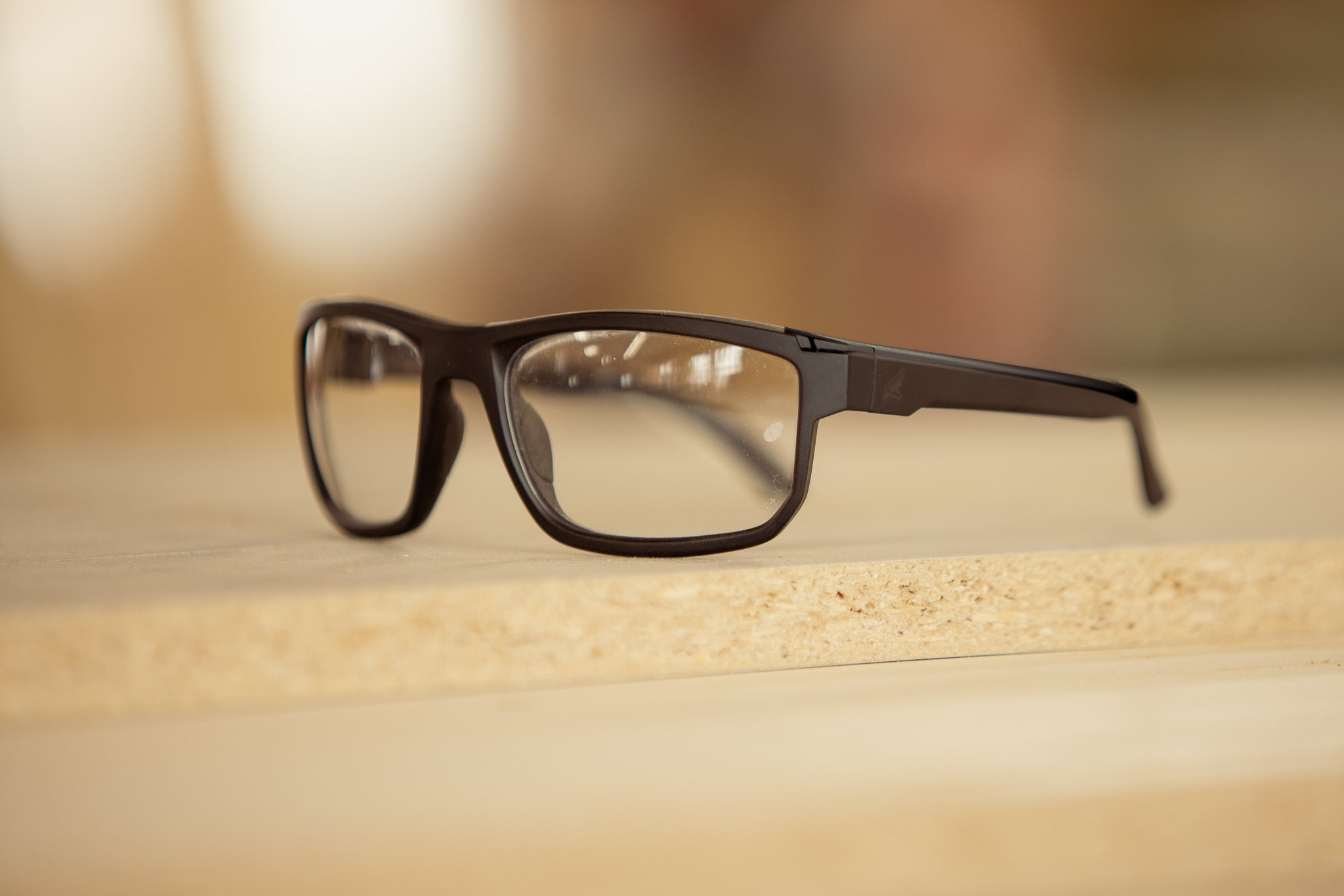 safety glasses on wood surface